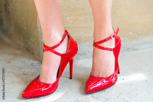 Female legs with red heels
