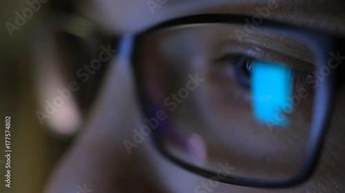 Wallpaper Mural Closeup shot of a female eye surfing the Internet at night. Reflecting a monitor in glasses Torontodigital.ca