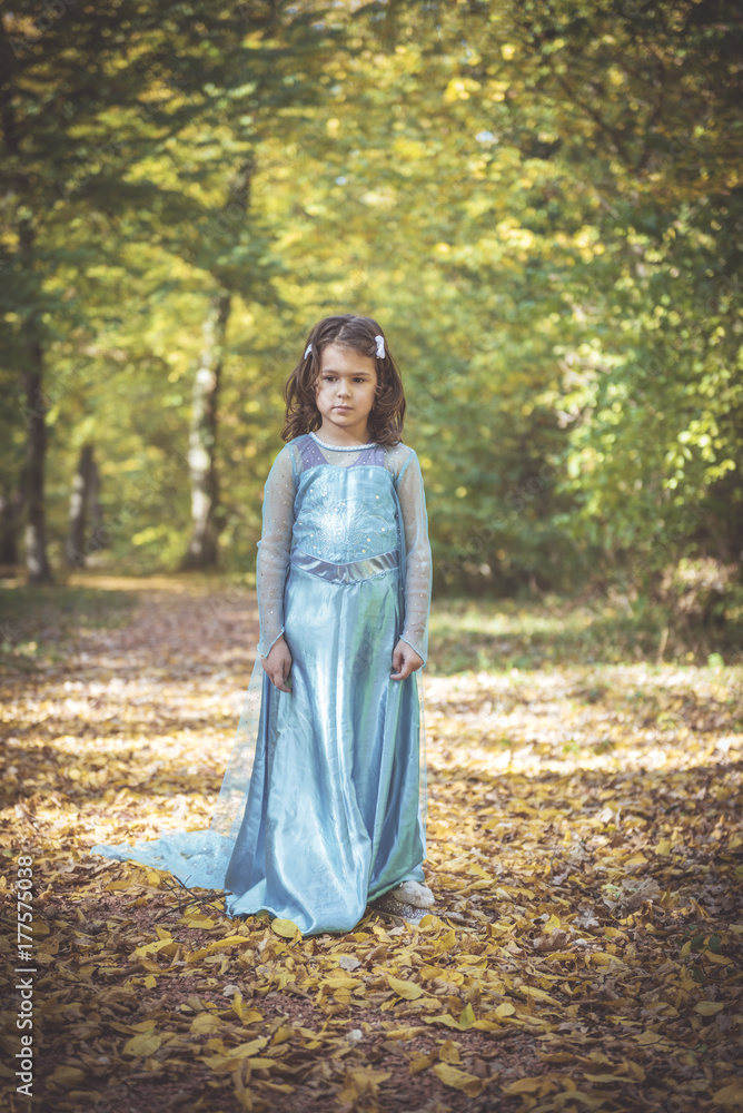 Little fashionable girl posing in the woods,selective focus Little fashionable girl posing in the woods,selective focus