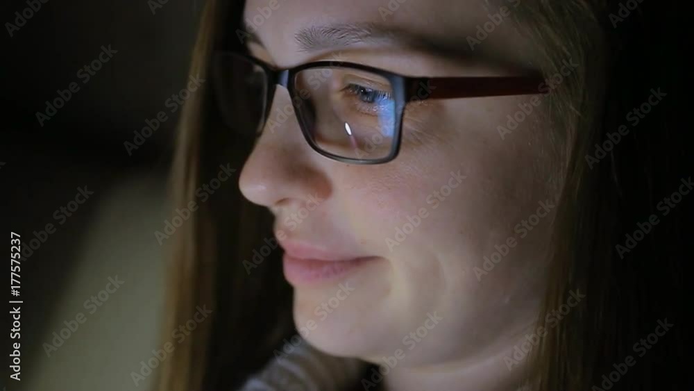 beautiful woman wearing glasses prescribes on laptop late at night at home, very surprised beautiful woman wearing glasses prescribes on laptop late at night at home, very surprised