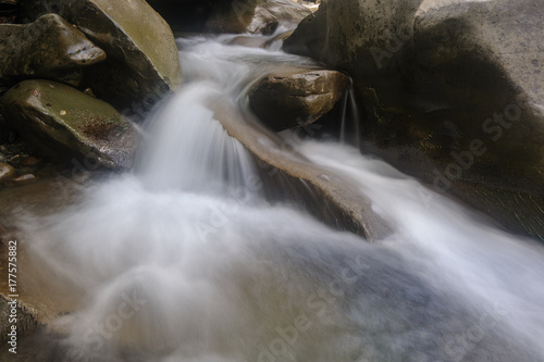 A small waterfall photographed in the hill. The lack of rain has greatly lowered the water level.
