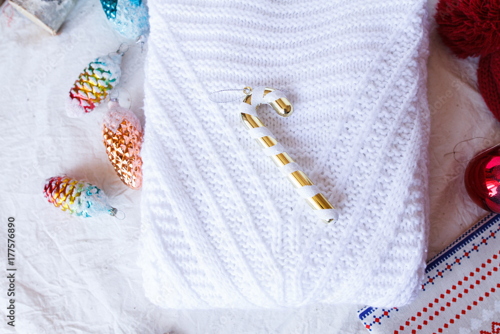 Christmas toys and candy on a knitted sweater Christmas toys and candy on a knitted sweater