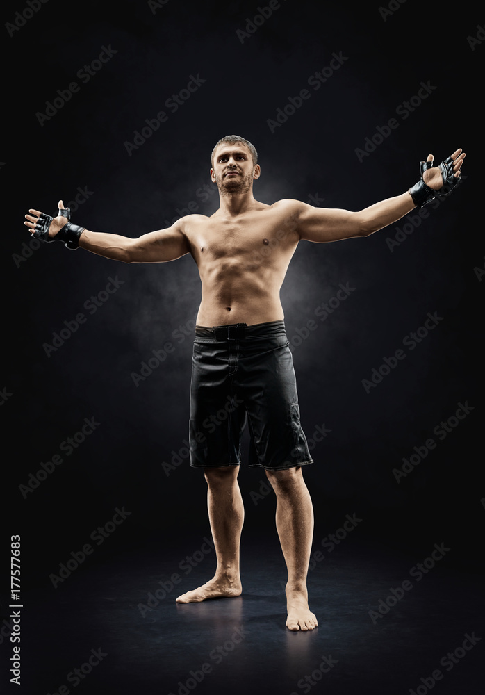 mma male fighter standing with hands up isolated