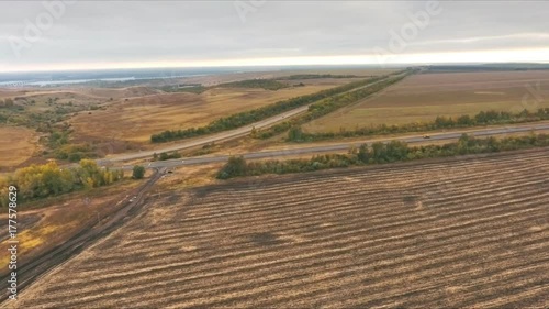 view over the early autumn fields and a dual carriageway road from the air photo