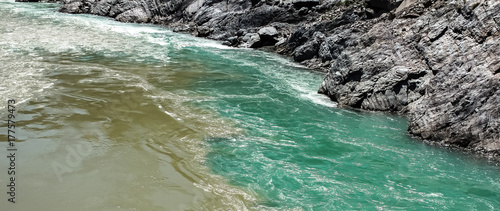 View of the confluence of the rivers Bhagirathi and Alaknanda in Devprayag, Uttarkhand, India photo