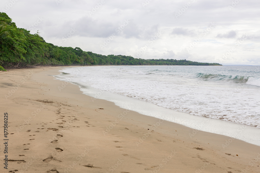 Tropical paradise beach in Costa Rica at cloudy day