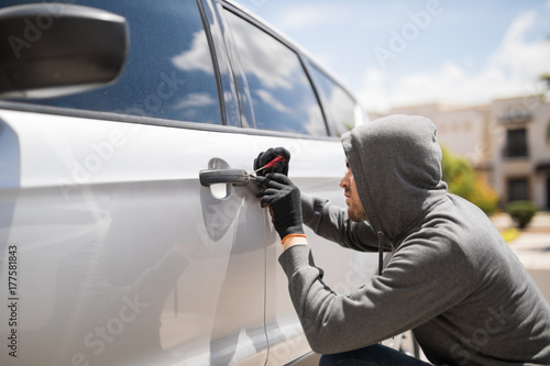 Quadro em tela Forcing entry and stealing a car