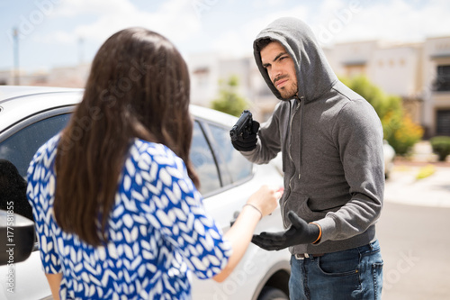 Stealing a car at gunpoint photo