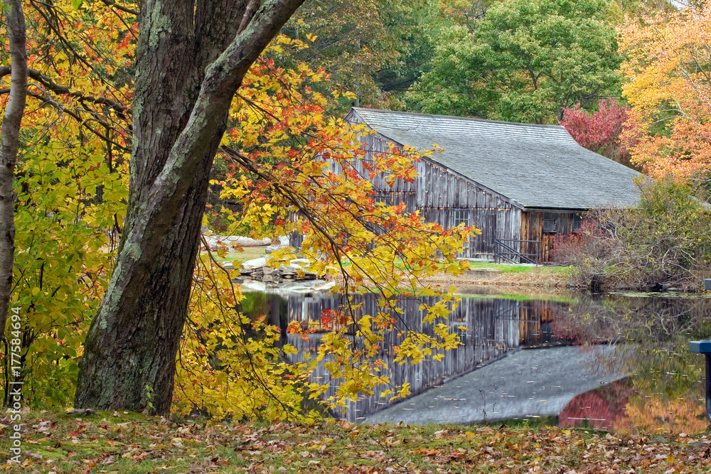 Saw mill reflected in a pond on a rainy October day Saw mill reflected in a pond on a rainy October day