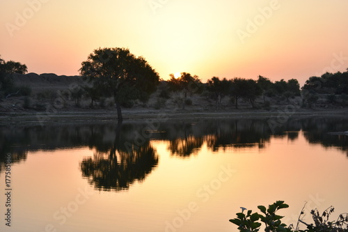 Fototapeta Naklejka Na Ścianę i Meble -  sunset in gadisar lake jaisalmer india