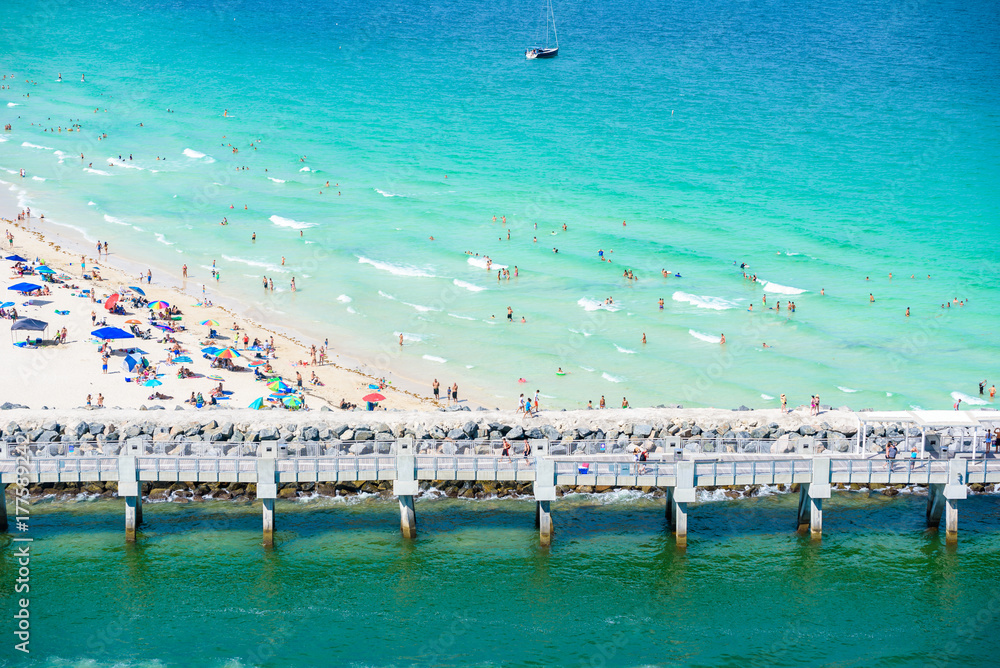 Fototapeta premium South Pointe Park and Pier at South Beach, Miami Beach. Aerial view. Paradise and tropical coast of Florida, USA.