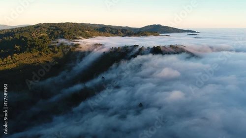 Wallpaper Mural Aerial drone shot of low laying clouds with setting sun close to the horizon Torontodigital.ca