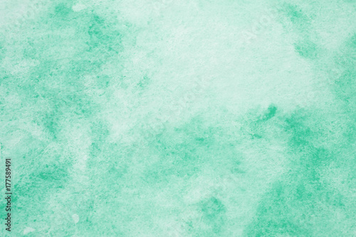 Green abstract watercolor painting textured on white paper background