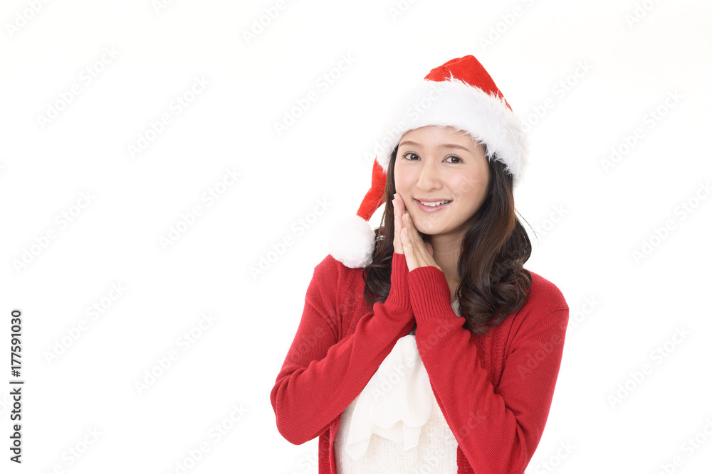 サンタ帽を被った笑顔の女性 サンタ帽を被った笑顔の女性
