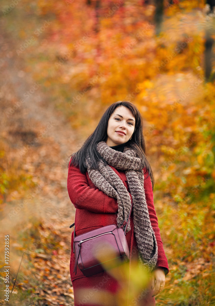 Lady brunette in autumn park Lady brunette in autumn park