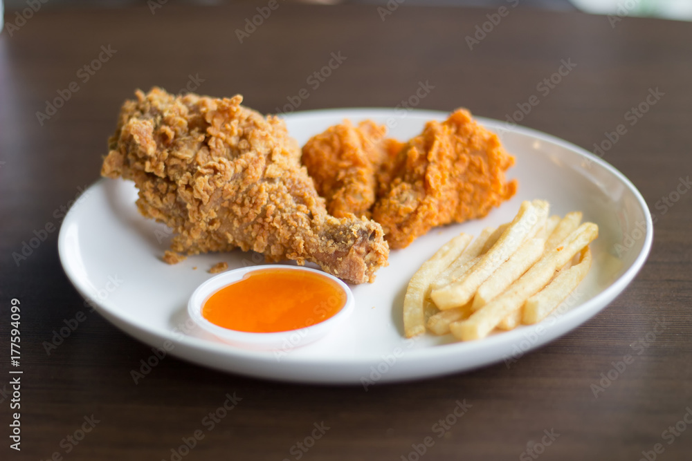 Fried chicken fried potatoes select focus or blurred Fried chicken fried potatoes select focus or blurred