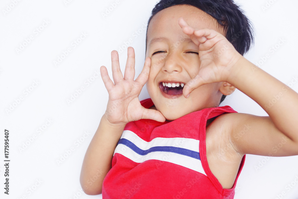 Cute asian child positive and real smile over white background Cute asian child positive and real smile over white background