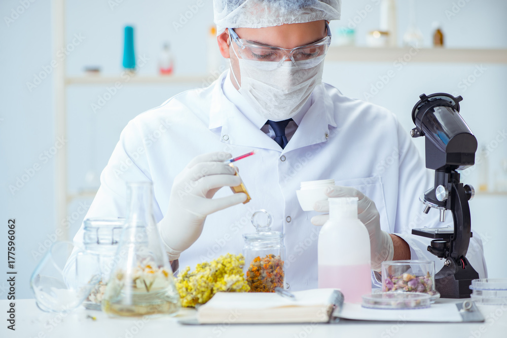 Chemist mixing perfumes in the lab Chemist mixing perfumes in the lab