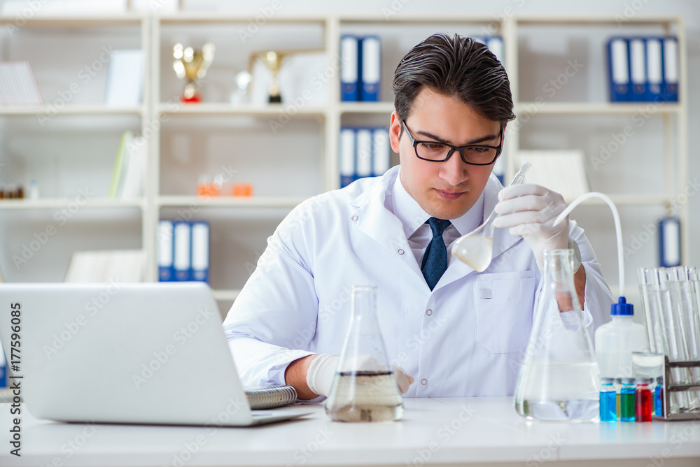Young researcher scientist doing a water test contamination expe Young researcher scientist doing a water test contamination expe