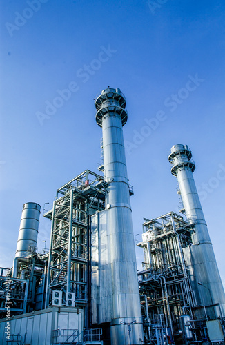 Industrial view at oil refinery plant form industry zone with cloudy sky	
