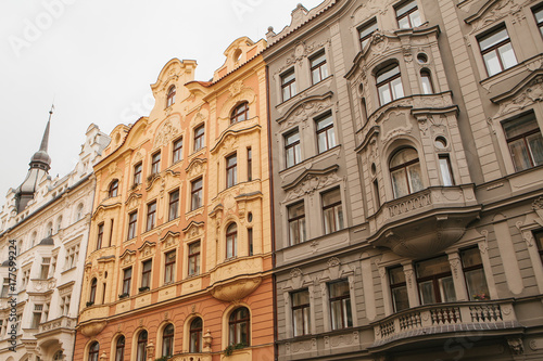 Traditional facade of buildings, exterior of buildings in Prague. Close-up of beautiful historic buildings standing tightly together