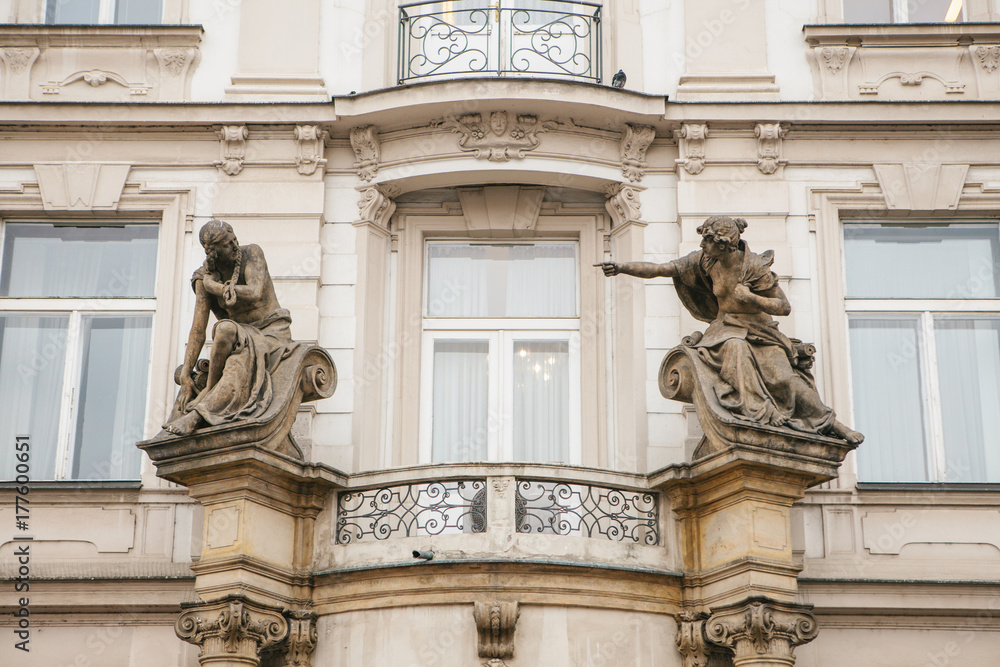 Antique style sculpture on the facade of building