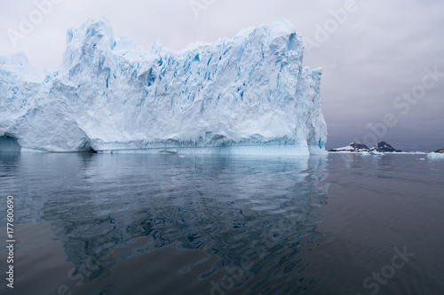 A huge iceberg has calved from a glacier. Showing beautiful blue ice © robert