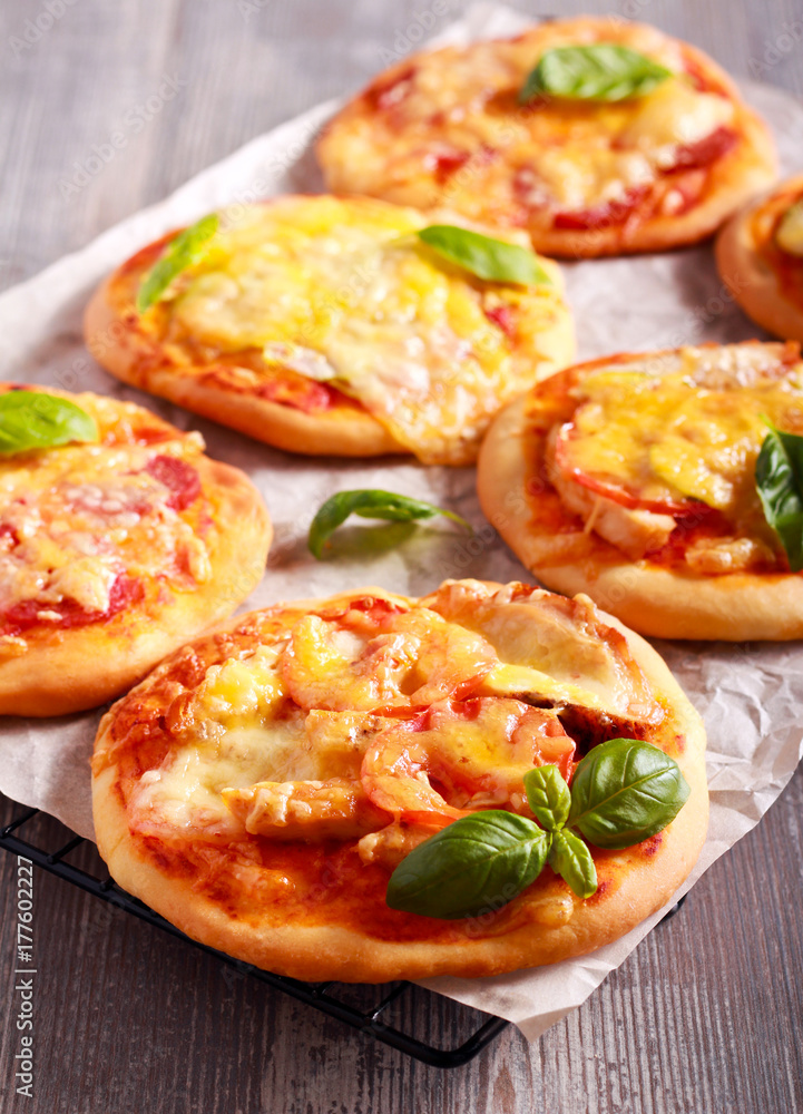 Homemade mini pizzas with different stuffing Homemade mini pizzas with different stuffing
