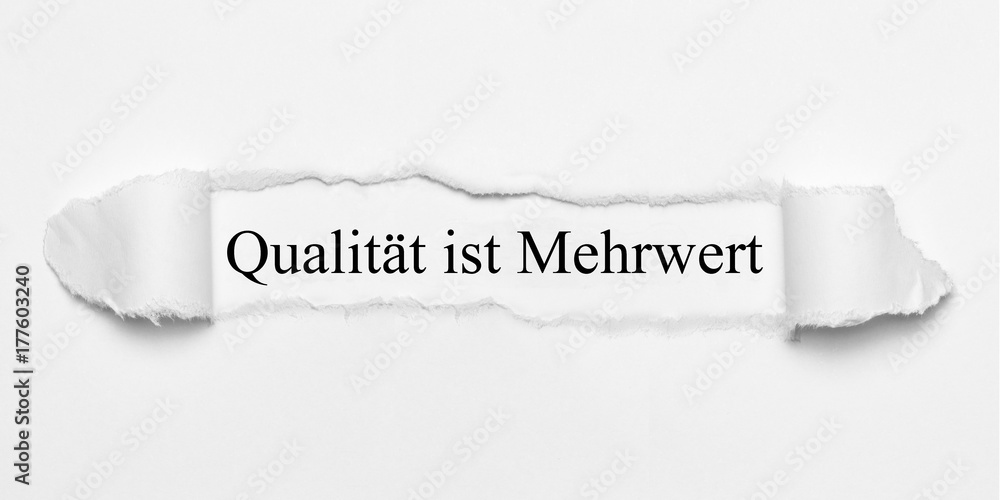 Obraz premium Qualität ist Mehrwert auf weißen gerissenen Papier