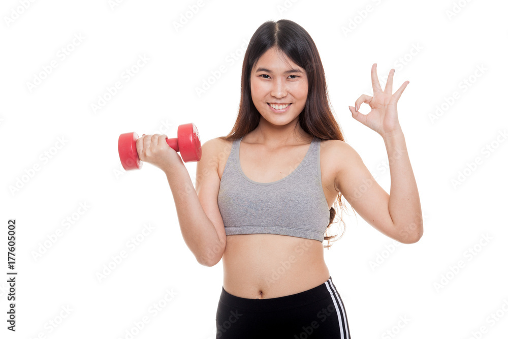 Beautiful Asian healthy girl show OK with dumbbell. Beautiful Asian healthy girl show OK with dumbbell.