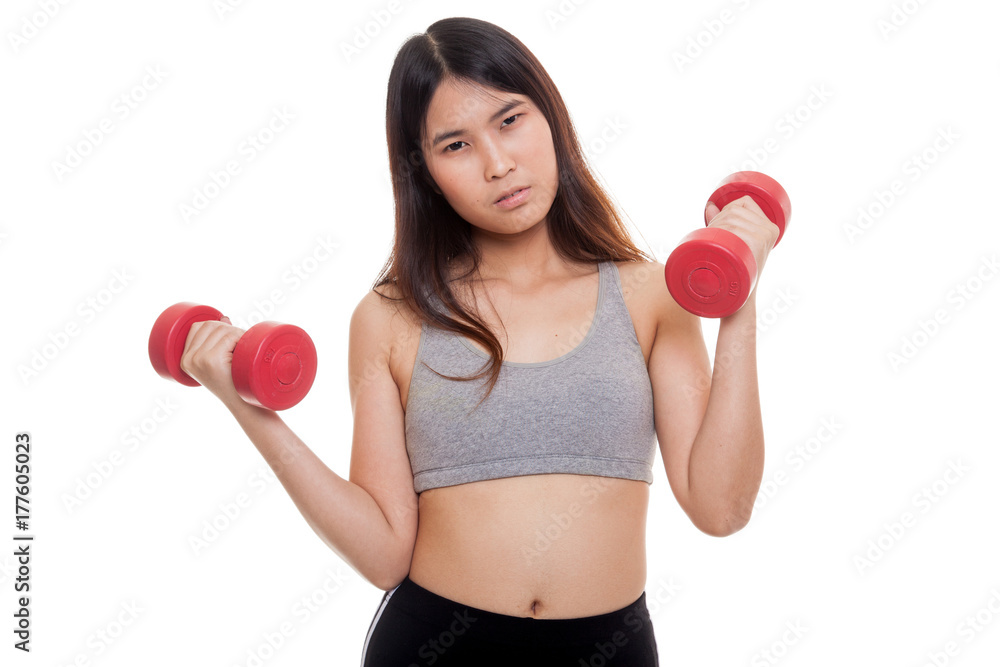 Tired Asian healthy girl exercise with dumbbell. Tired Asian healthy girl exercise with dumbbell.