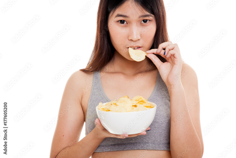 Beautiful Asian healthy girl eat potato chips. Beautiful Asian healthy girl eat potato chips.