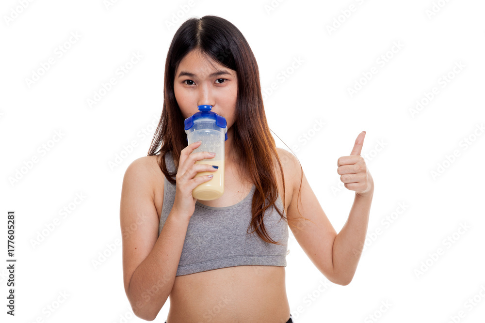 Beautiful Asian healthy girl show thumbs up drink whey protein. Beautiful Asian healthy girl show thumbs up drink whey protein.