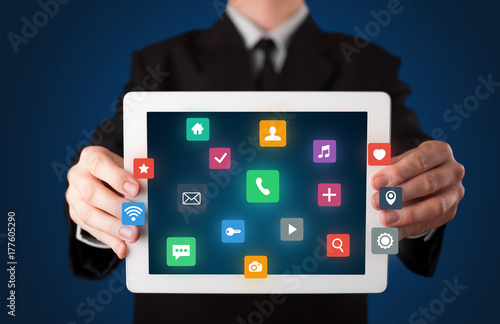 Wallpaper Mural Businessman holding tablet with multimedia concept Torontodigital.ca