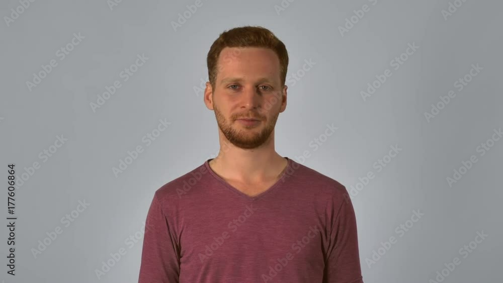 caucasian guy with red hair sneezing. handsome redhead men wearing in casual t-shirt. portrait young man on grey background has allergy or common cold caucasian guy with red hair sneezing. handsome redhead men wearing in casual t-shirt. portrait young man on grey background has allergy or common cold