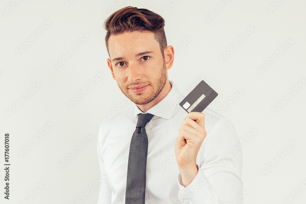 Confident man using credit card to be mobile Confident man using credit card to be mobile