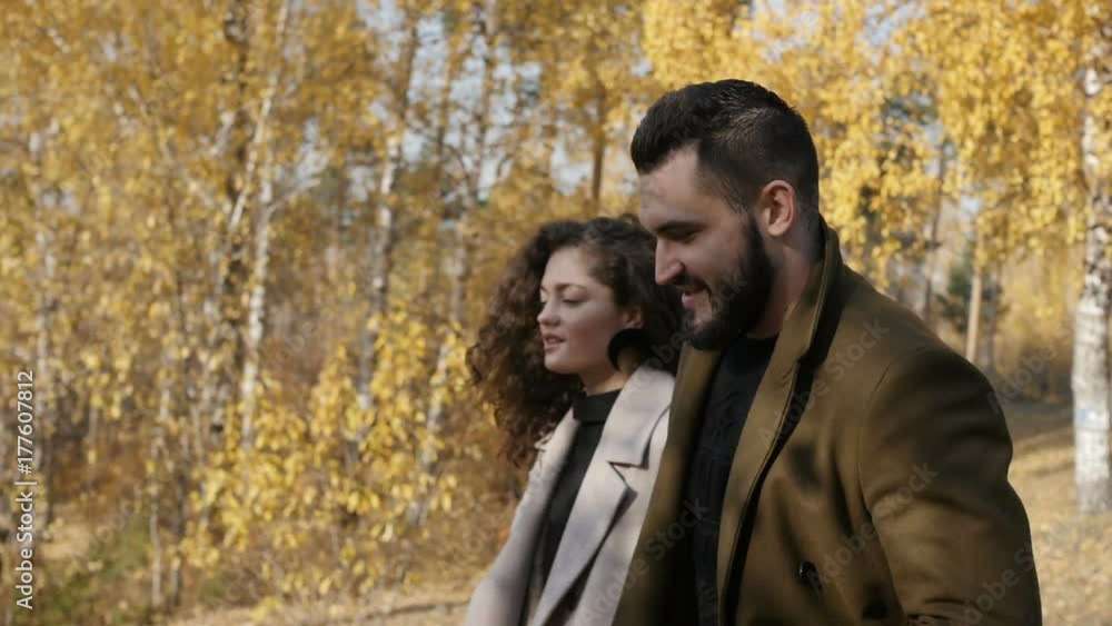 Couple walking in autumn park Couple walking in autumn park