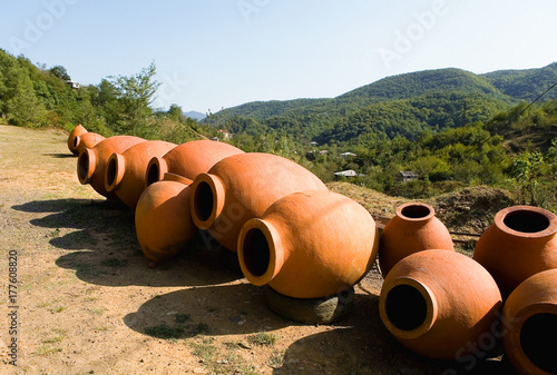 Large clay jugs for wine are put up for sale.