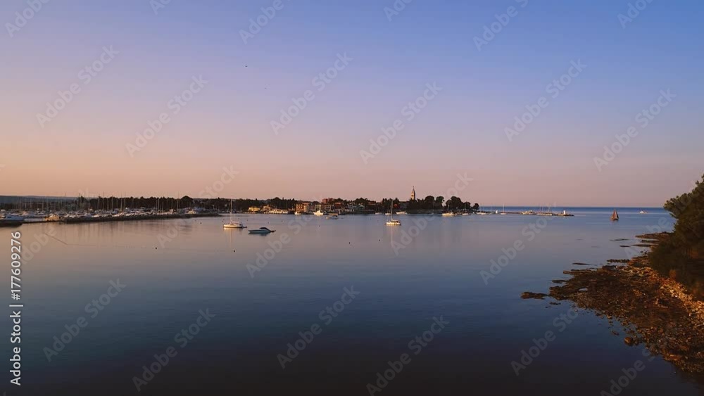 aerial drone view of sunrise over novigrad in summer