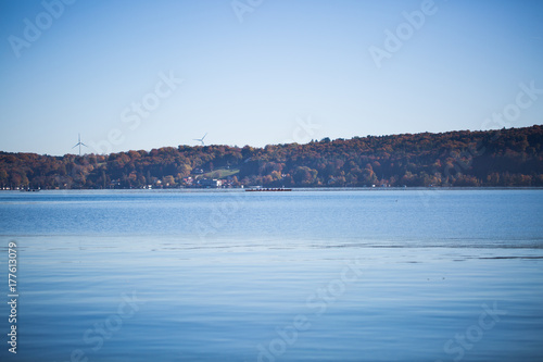 Autumn at Lake Starnberg, bright blue sky, glittering water