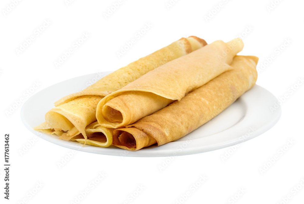 Plate with thin rolled pancakes isolated on white. Plate with thin rolled pancakes isolated on white.