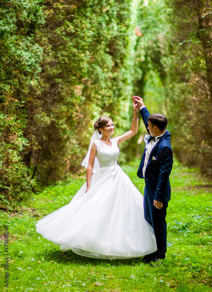 Happy couple walking in the woods