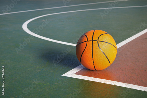 orange basketball on court in gymnasium sport competition floor background