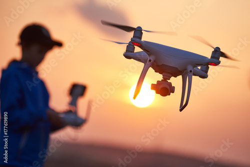 drone flying at sunset