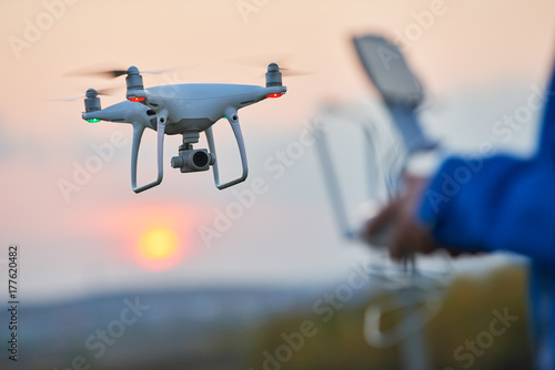 drone flying and operated by remote controlsunset photo