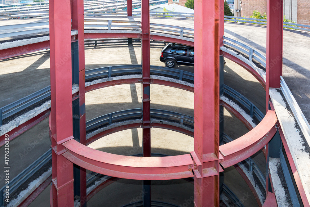 Circular ramp in the modern multi-level parking garage Circular ramp in the modern multi-level parking garage