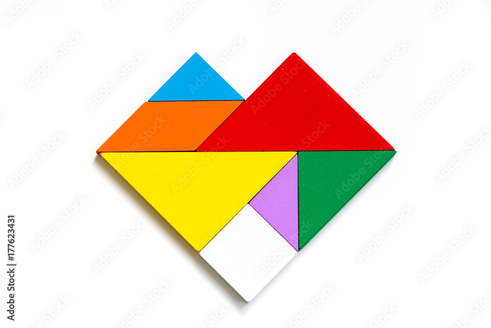 Colorful wood tangram puzzle in heart shape on white background Colorful wood tangram puzzle in heart shape on white background