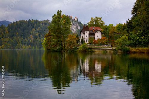 A manor in Lake Bled shore with autumn colors and reflection