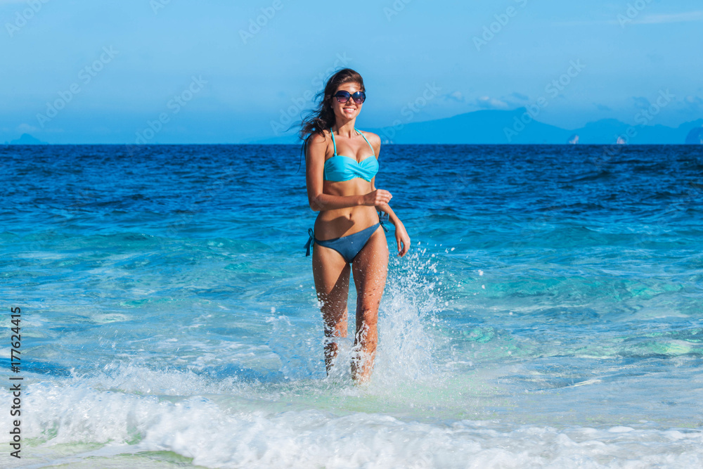 Girl running from sea