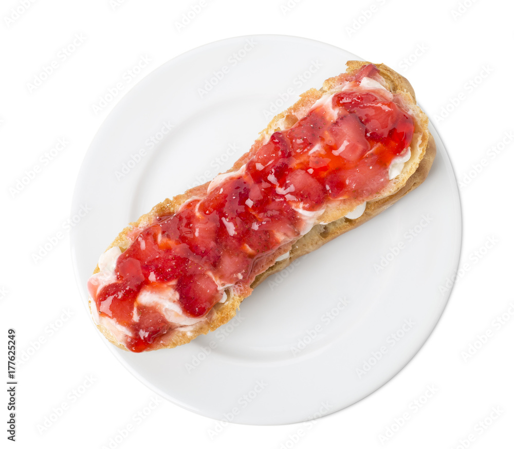 Delicious eclair with strawberry jam. Delicious eclair with strawberry jam.